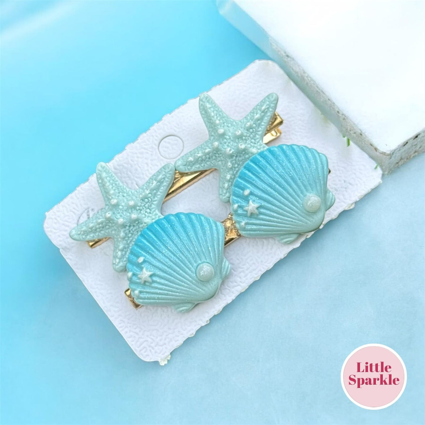 Sea shell pins